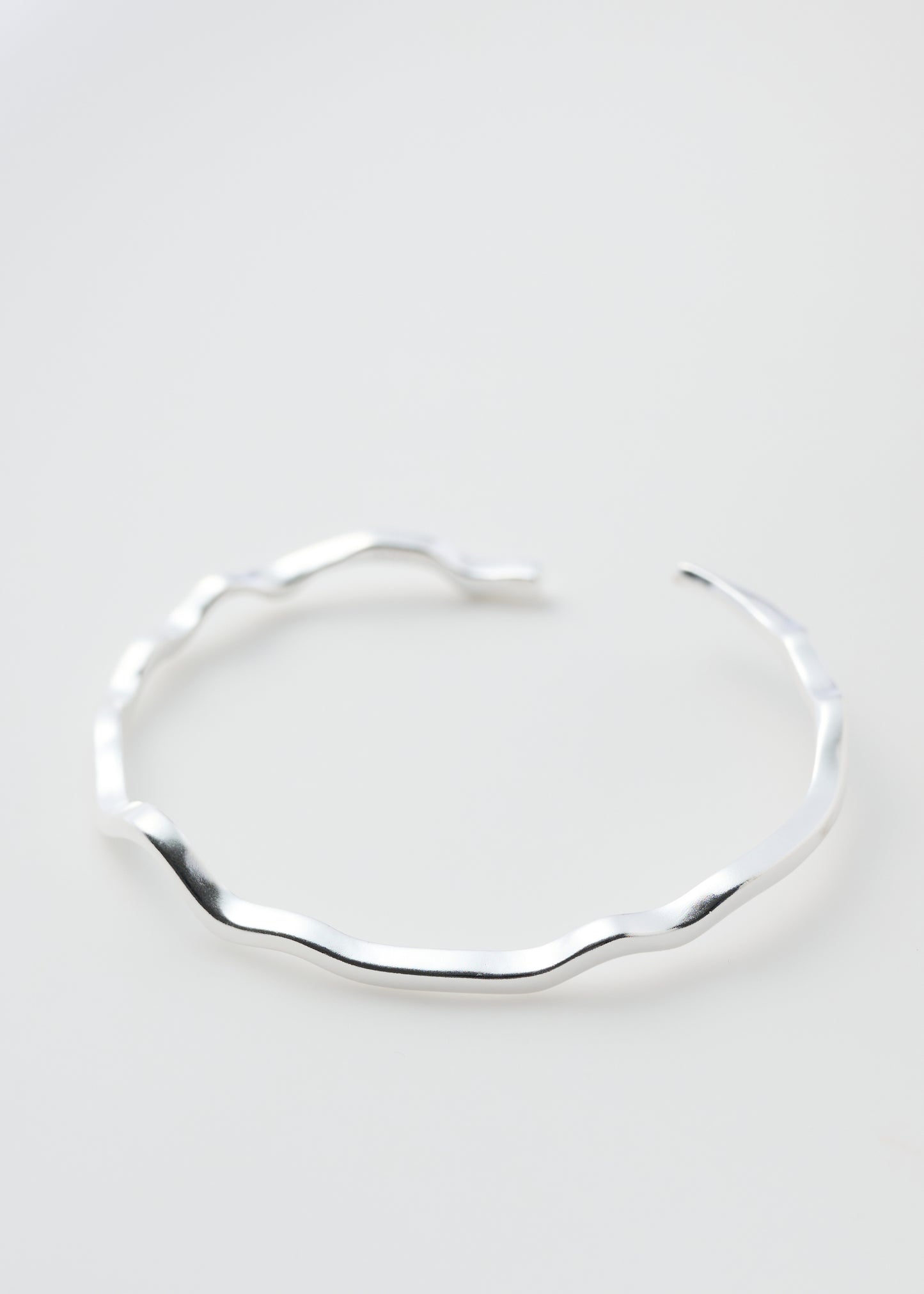 Uneaven Silver Bangle
